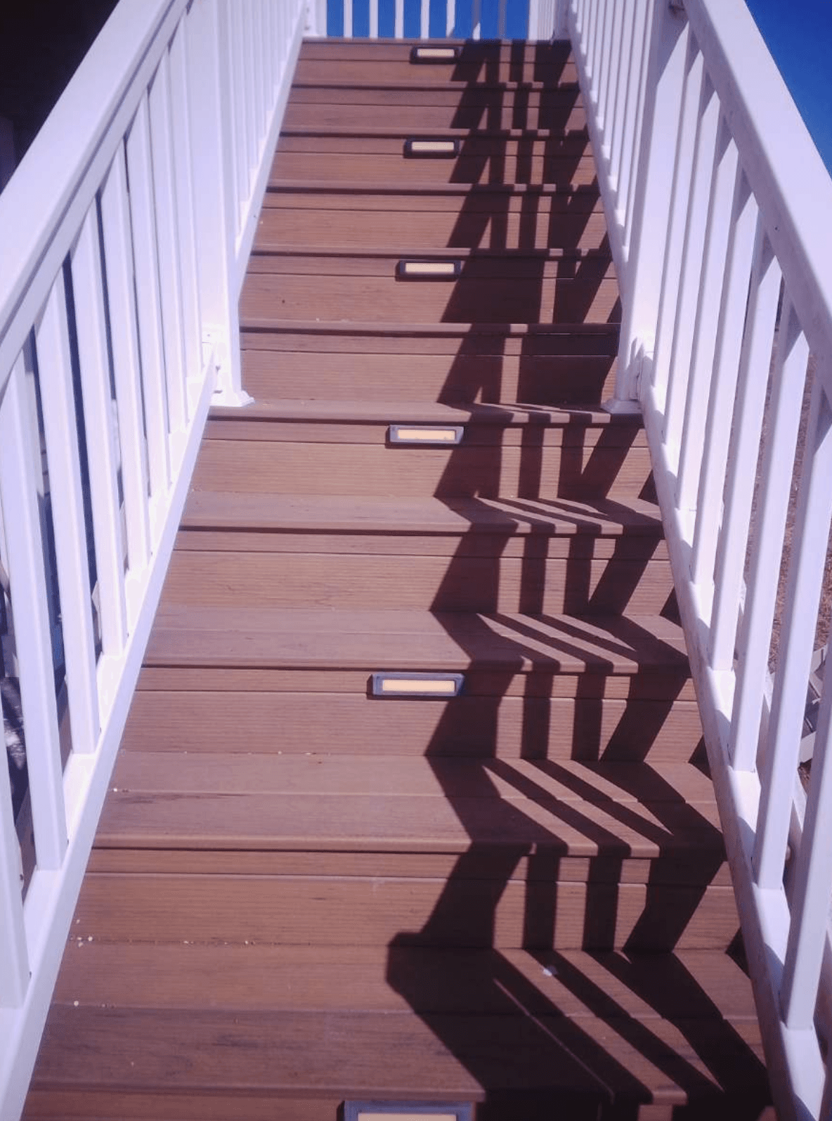 Inspector checking stairway construction quality in a new build